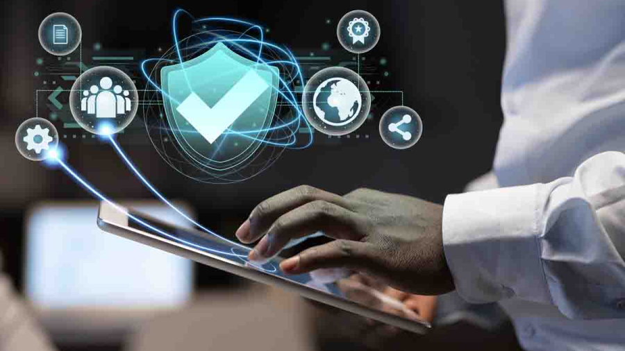 Female blogger with laptop recording video while sitting at offi